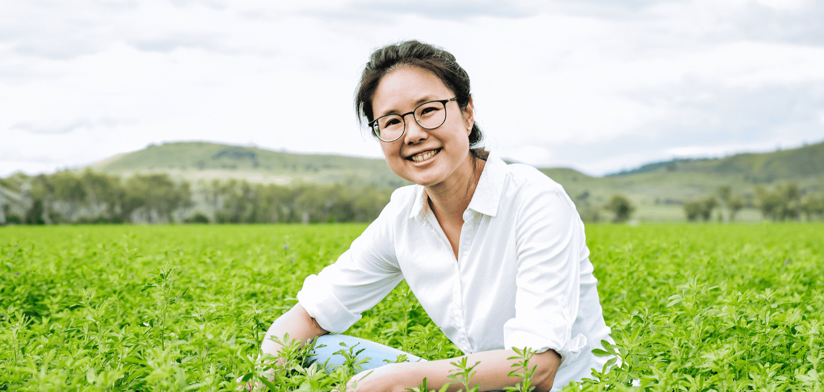 Fern Ho Founder of The Leaf Protein Co in a field.